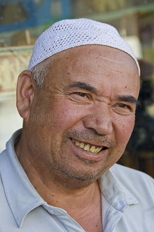 Local man with Muslim hat.