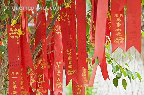 Red and gold Good-Luck banners at the Great Buddha Temple.