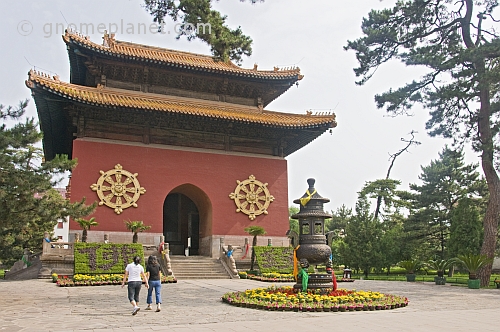 Incense burner and gateway to Putuozongcheng Buddhist Temple.