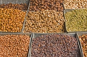 A range of nuts and dried fruit for sale at the market.