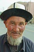 Elderly Uighur man with hat and beard.