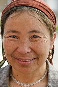 Uighur woman with head-scarf.