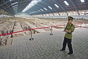 Chinese guard watches over the Terracotta warriors in pit number 1.