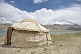 Image of A yurt next to Karakul Lake on the Karakoram Highway, with view of the snow-capped Pamir mountains.