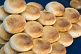 Image of Bread buns with sesame seeds on a blue cloth.