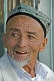 Image of Local man with Uighur hat and gold teeth.