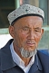 Local man with Uighur hat and weather-beaten face.