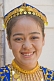 Image of Smiling Uighur girl in local dress.