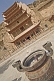 Incense burns in front of the multi-layered roofs that protect access to the Buddhist Mogao Caves.