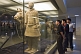 Image of Chinese visitors admire a Terracotta Soldier and horse.