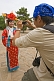 Image of Chinese tourist photographing Putuozongcheng Buddhist Temple girl.