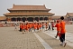 Image of Chinese school-children in orange teeshirts visit Gate of Supreme Harmony at the Forbidden City.