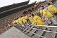 Image of Chinese school-children in yellow teeshirts visit the Forbidden City.