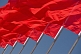 Image of Red flags billowing in the wind of Tiananmen Square.
