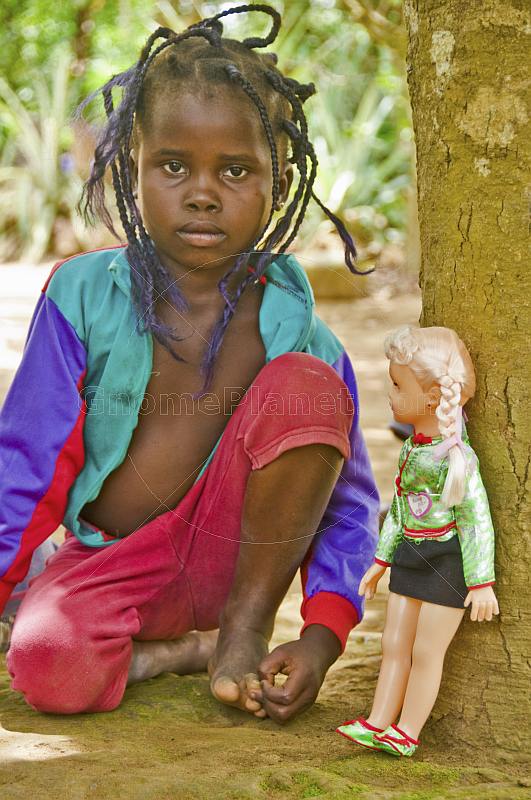 Young Congolese girl with a plastic doll.