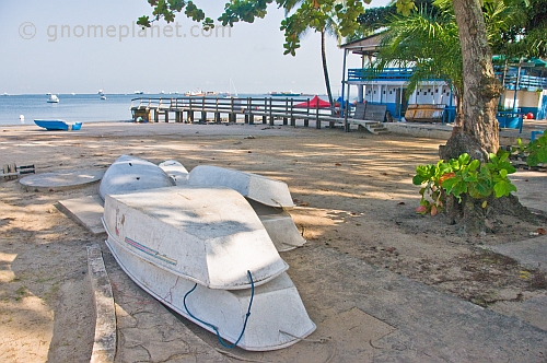 Dinghys stacked on the beach at the Pointe Noire Yacht Club.
