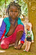 Young Congolese girl with a plastic doll.