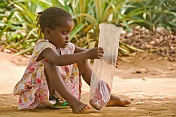 Young Congolese girl with a plastic bag.