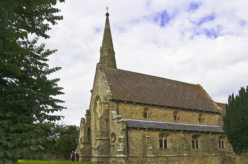 Sandstone walls and spire of All Saints Church at Thirkleby.