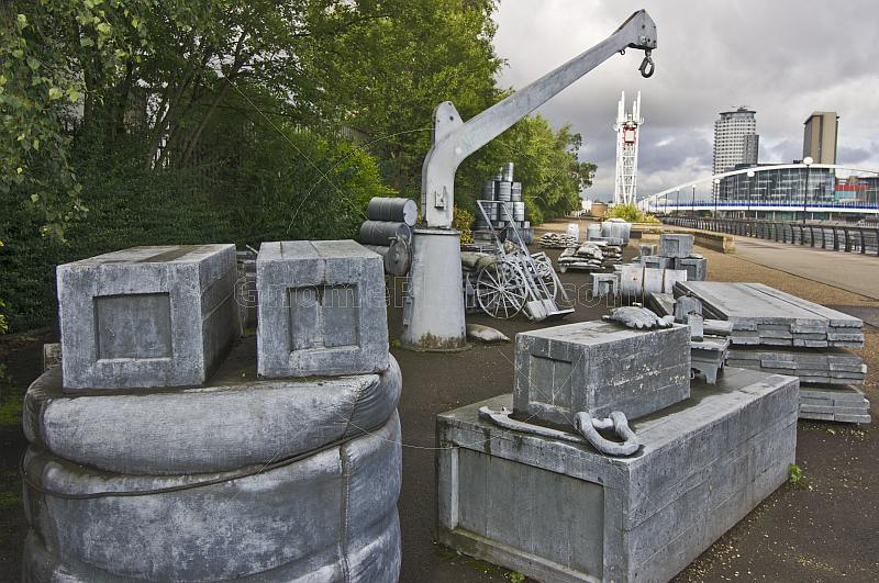 The Silent Cargoes sculpture by artist James Wine at the side of Salford Quays on Manchester Ship Canal.