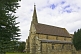 Image of Sandstone walls and spire of All Saints Church at Thirkleby.