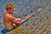 caption: Blonde man with Fishes